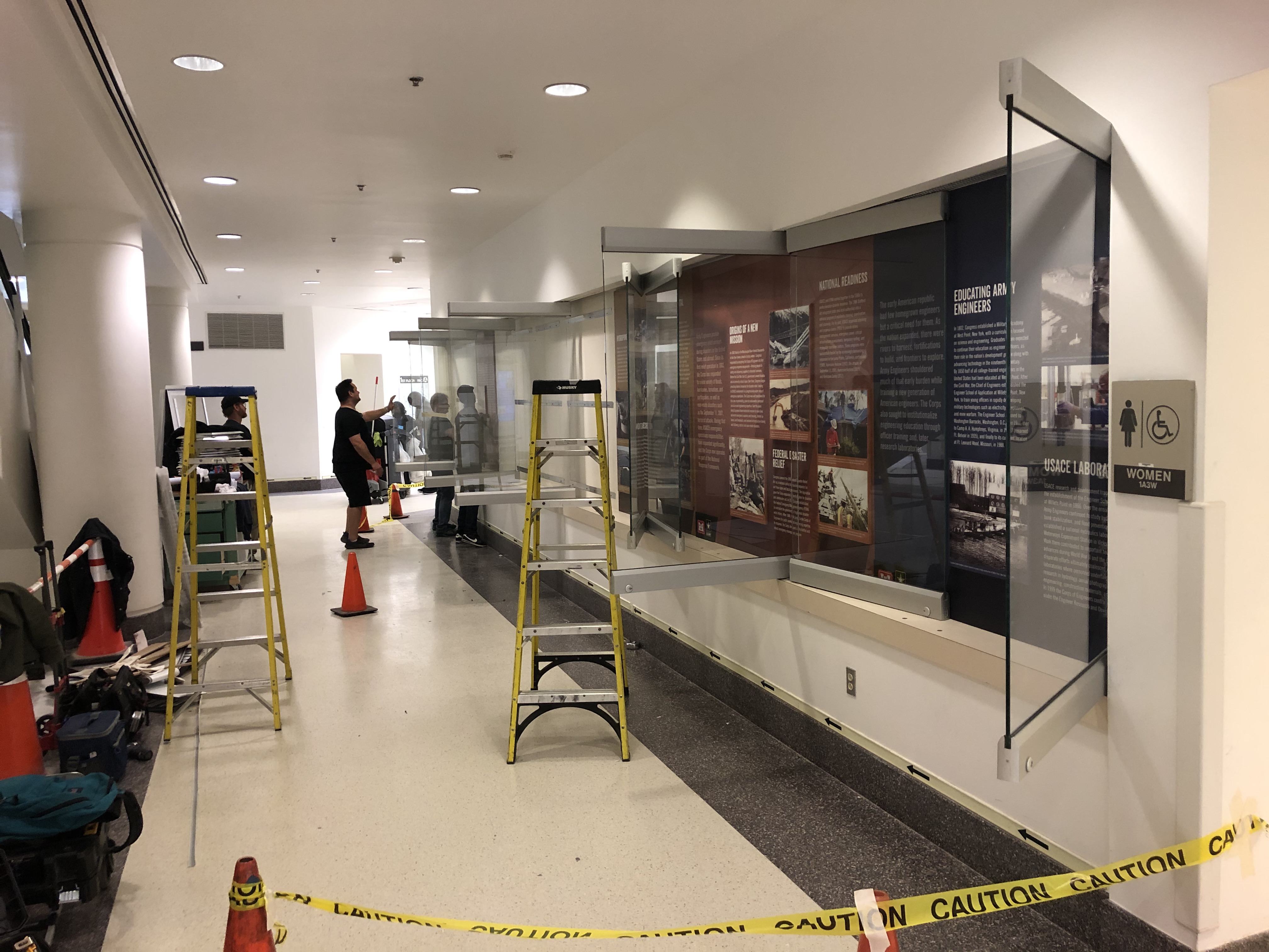 Men installing panels in wall cases